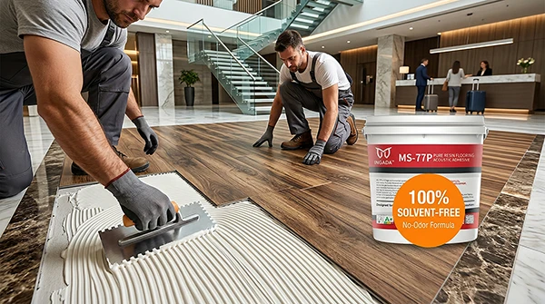 Professional contractors installing luxury wood-grain flooring in a hotel lobby using INGADA MS-77P solvent-free and no-odor acoustic adhesive, demonstrating clean and eco-friendly commercial indoor application.