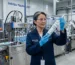 INGADA quality engineer conducting raw material and extrusion testing inside an ISO 9001 certified OEM sealant manufacturing facility.